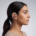 Woman wearing BYZ S625 rose gold clip-on open-ear earphone