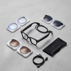 AIMB-G1 smart glasses flat lay with 3 lens sets, charging cable and pouch